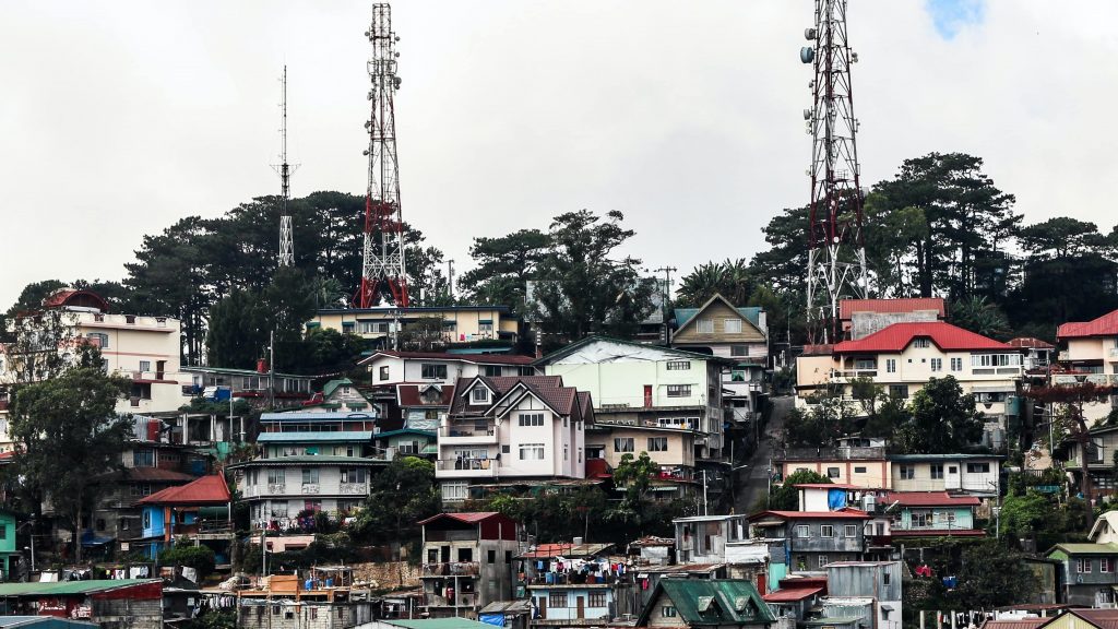 Baguio City Houses stacked on top of a hill. Photo by Sebastian Herrmann. Via Unsplash.com